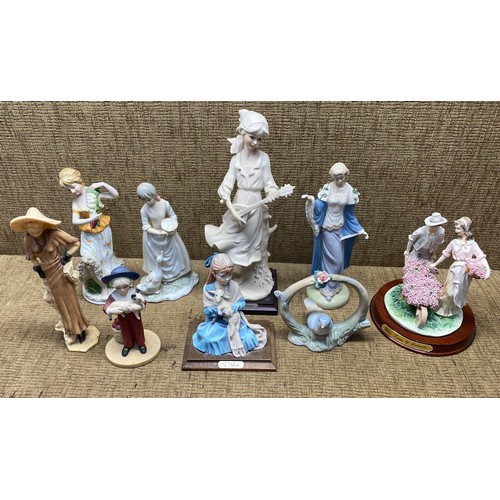 586A - Nine figurines including Spanish and Italian.