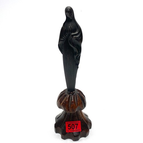 507 - Bronze figure of Mother Mary mounted on a arts and crafts wooden base.