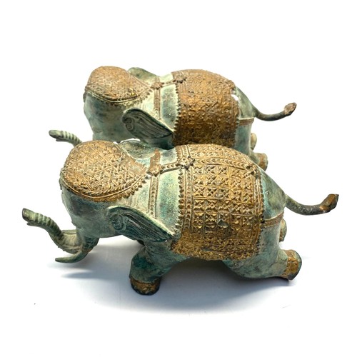 708 - Pair of bronze traditional elephants.