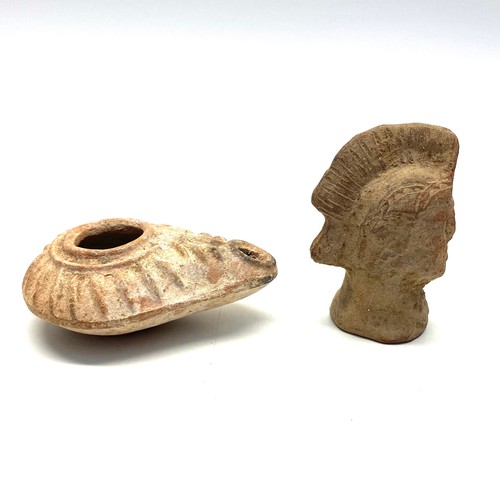 709 - Ancient roman oil lamp and gladiator figure.