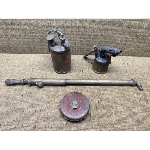 407 - Vintage tools including: Measuring tape, oil can, hand pump and blow torch.