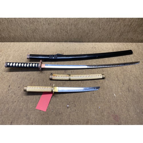 890 - 2 decorative Samurai swords (Katanas). (18+ local collection only - Shipping available at extra cost... 