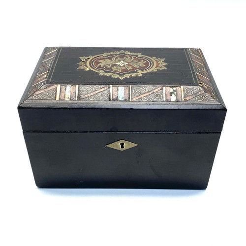 583 - Small tea caddy ebonised with marquetry.