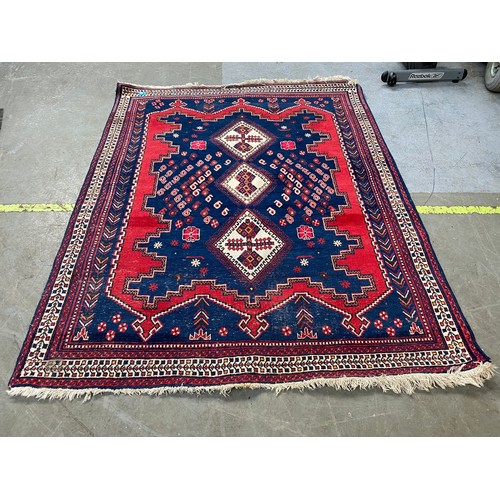 941 - Large hand woven rug; 190cm x 154cm.