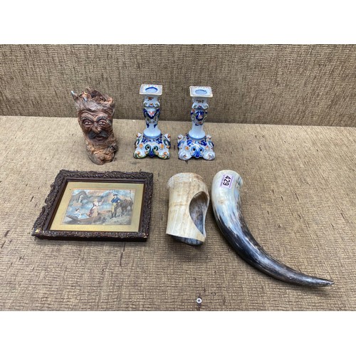 429 - Mixed selection of candle sticks, a horn and a carved treen face.