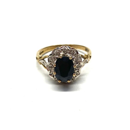 776 - 9ct gold ring with diamond surround and large Onyx. Size P, 3.4g.