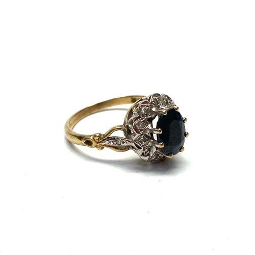 776 - 9ct gold ring with diamond surround and large Onyx. Size P, 3.4g.