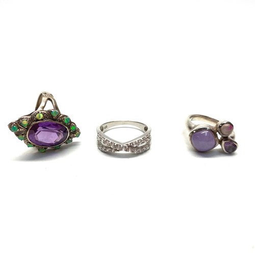 782 - Three silver dress rings , Three stone Amethyst size L, bow ring size Q and Vintage Amethyst and gre... 