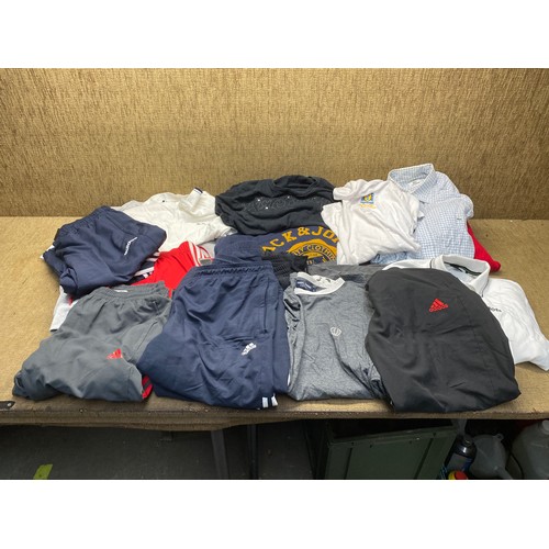 140 - Mixed selection of men’s clothing sizes L and XL including jack and jones, adidas, and puma.