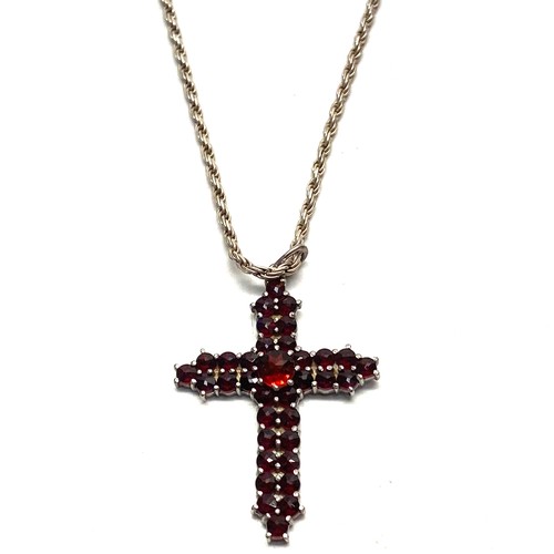 794 - 2 silver necklaces, sliver earrings and a silver cross.