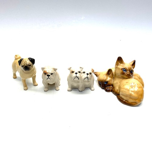 801G - Four Beswick figures of cats and dogs.