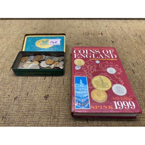 470F - Collection of coins in a tin and a book on British coins.