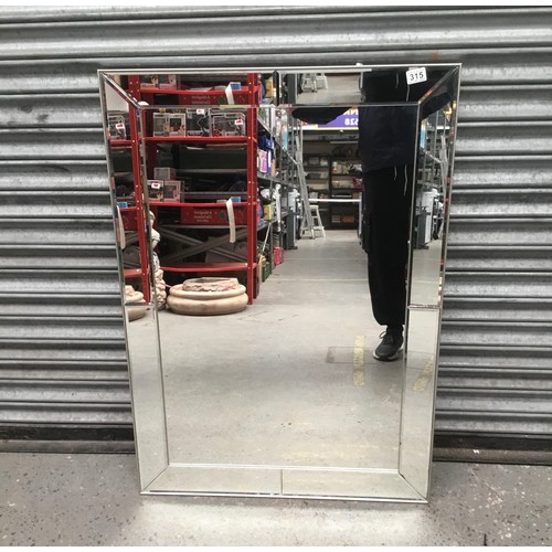 315 - Bevelled edged mirror 76x107cm.