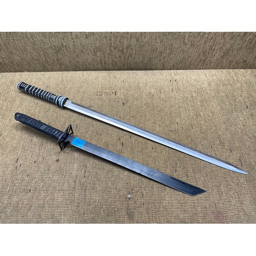 1021 - 2 movie replica swords. (18+ local collection only).