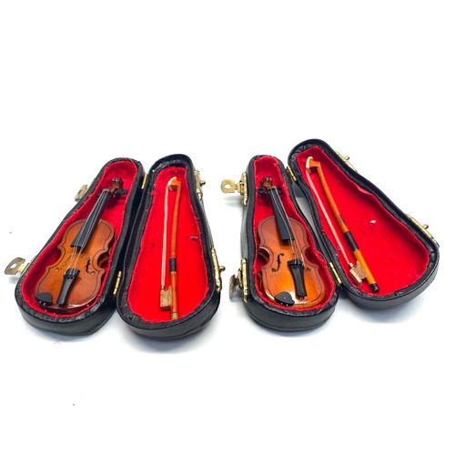 675 - 2 miniature violins.