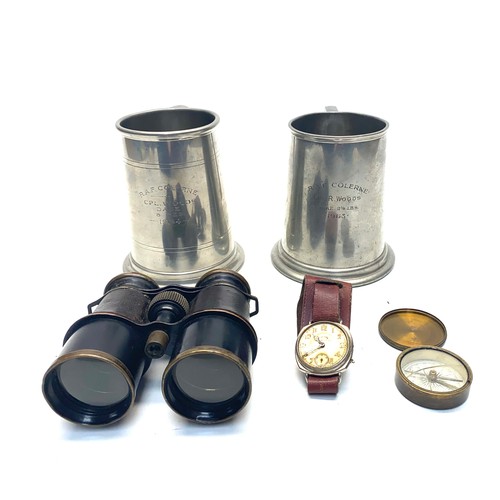 679 - Military collectibles including: Binoculars and compass.