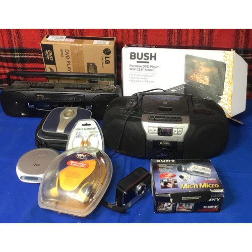 69 - Electrical items including LG DVD player,Bush portable DVD player and Sony Walkman