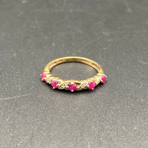 807 - 9ct Gold Ring with diamonds and ruby's. Size M 1.6g