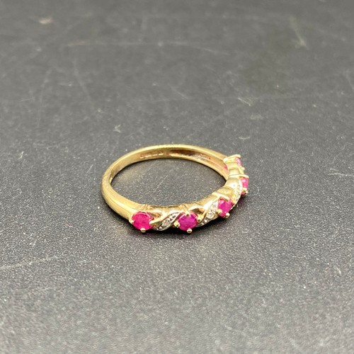 807 - 9ct Gold Ring with diamonds and ruby's. Size M 1.6g