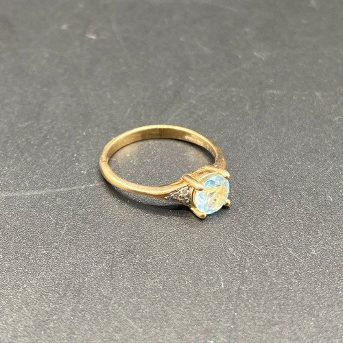 809 - 9ct gold ring with Aqua marine stone and diamond shoulders. Size N. 2.1g.