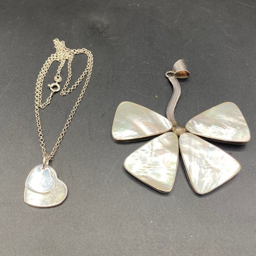 823 - Large silver leaf pendant with mother of pearl and a silver double heart pendant and silver chain.