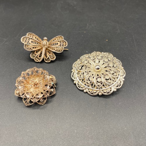 711 - Three silver filigree brooch's.