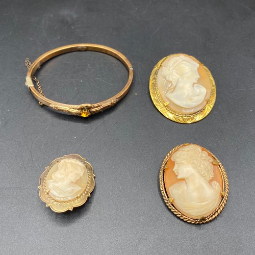 713 - 18k antique rose rolled gold bracelet and three rolled gold cameos.