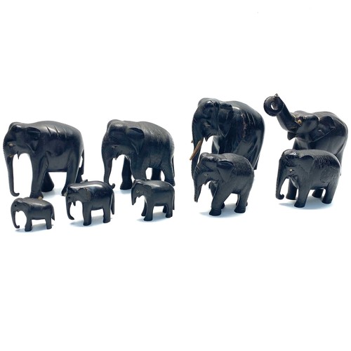 699 - Nine carved elephant figures