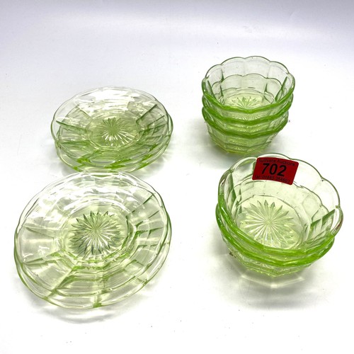 702 - A set of uranium glass bowls with saucers