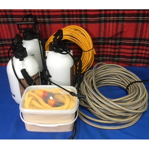 84 - Three hose pipes and three 5L garden sprayers