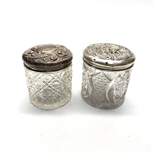 725 - Two cut crystal silver lidded vanity jars. one with Jacobean scene Birmingham  1909 by Henry Manton ... 