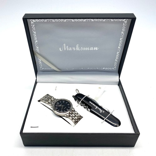 879 - Two marksman boxed watches with pens and keyrings.