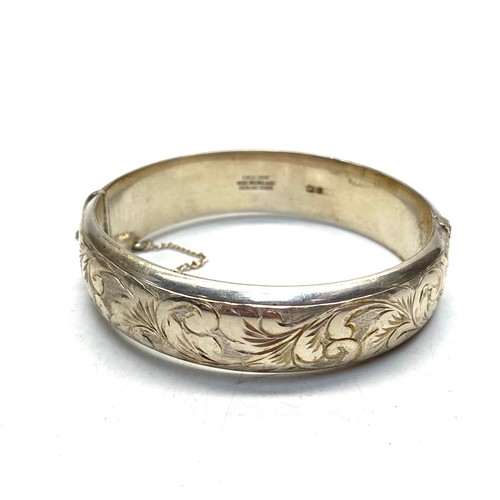 893 - Sterling silver bangle with inscription 