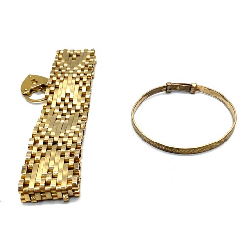 899 - 9ct rolled gold bangle and Gold plated gate bracelet.