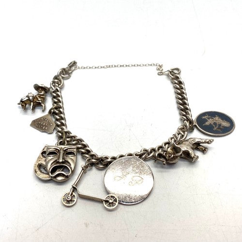 903 - Silver charm bracelet.