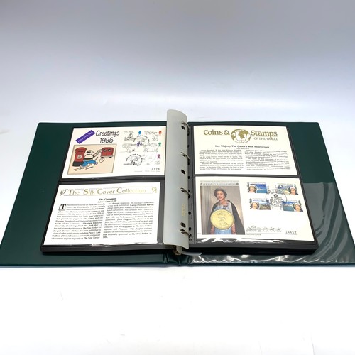 935 - Large collection of world coins and first day covers in a folder.