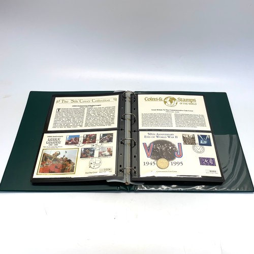 935 - Large collection of world coins and first day covers in a folder.