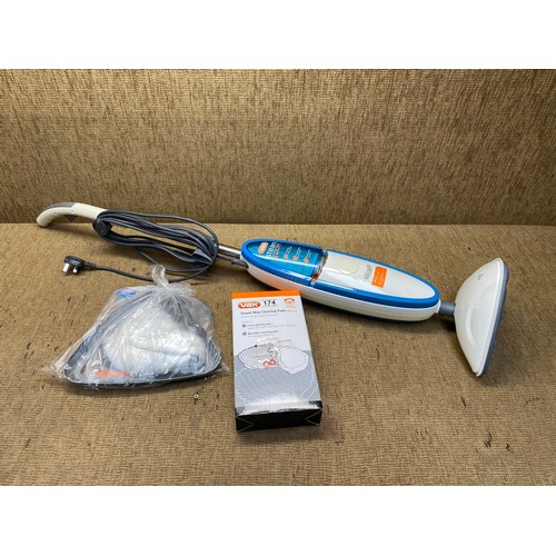 174 - Vax steam mop and accessories (also includes a new box of cleaning box.)