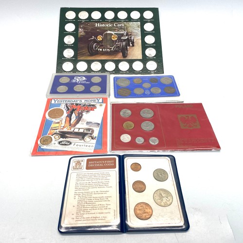 957 - Five coin sets including one from Poland and Historic cars.