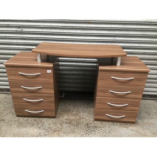 295 - A pair of bedside tables with four drawers also converts to dressing table