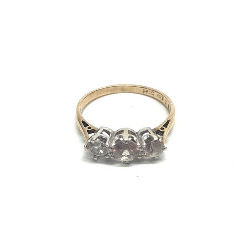 814C - 9ct gold and three stone diamond trilogy ring with a platinum mount. approx. 0.7kt.Size L. 1.8g.