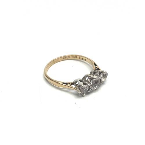 814C - 9ct gold and three stone diamond trilogy ring with a platinum mount. approx. 0.7kt.Size L. 1.8g.