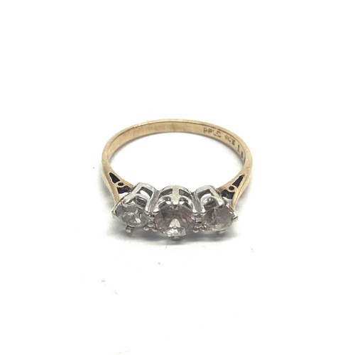 814C - 9ct gold and three stone diamond trilogy ring with a platinum mount. approx. 0.7kt.Size L. 1.8g.