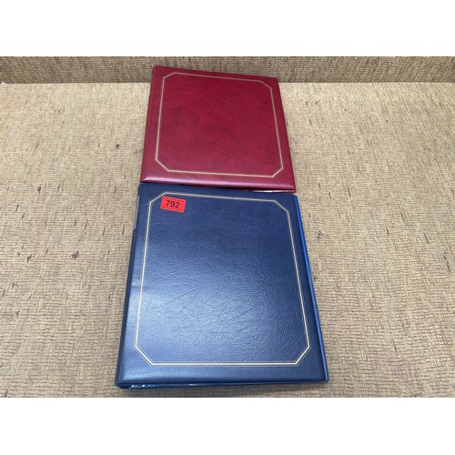 792 - One Red and one Blue deluxe stamp albums containing stamps from Norway and China.