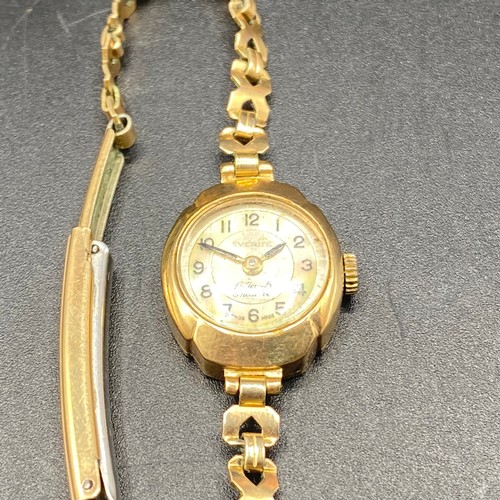 805 - 9ct gold ladies 17 Jewel Swiss made watch by Everite. Rolled gold strap (not running).