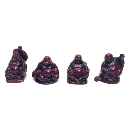 612 - 4 miniature red resin Japanese laughing Buddhas.