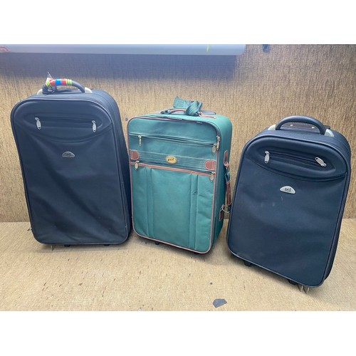 59 - 3 suit cases by PCL luggage.