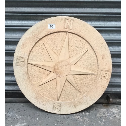 95 - Large round paving slab depicting compass points