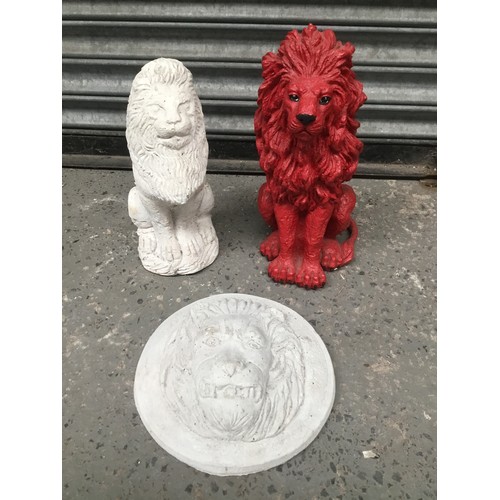 104 - Two concrete lion garden ornaments and a red lion in resin