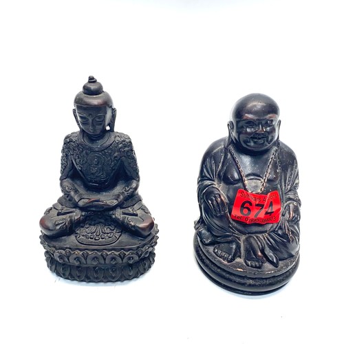 674 - 2 resin ebonised buddhas.